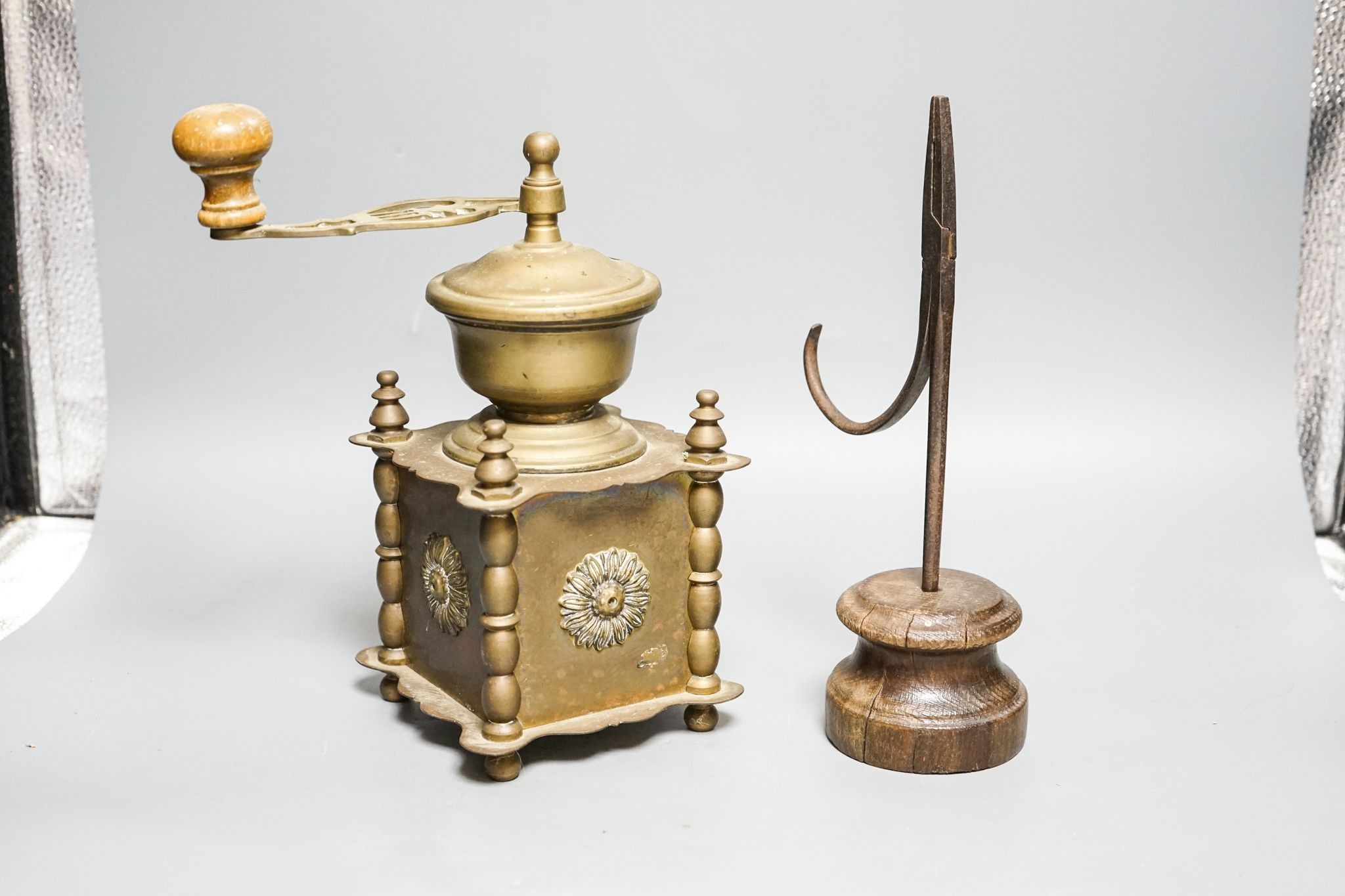 A 17th century rushlight nip and a later brass coffee grinder